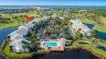Lakeside Community With Pool in Foreground & 5575 Marked Red Arrow